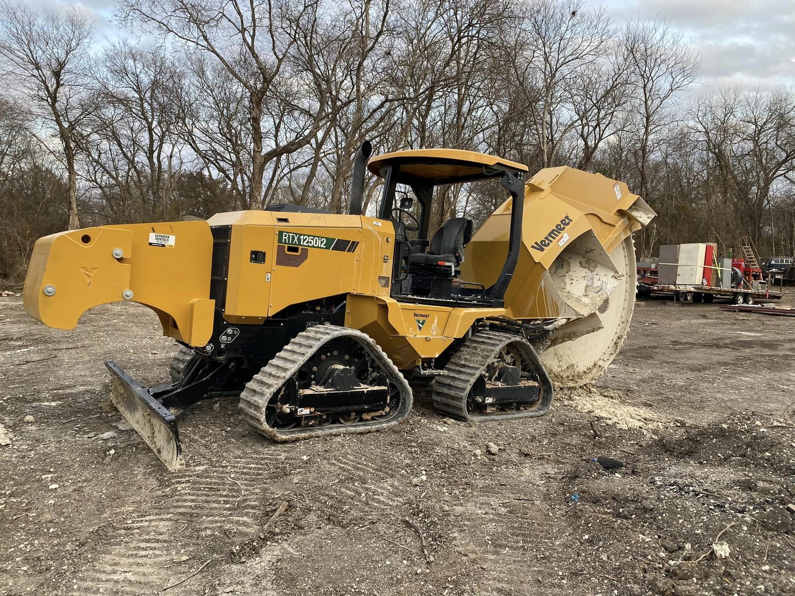 Track loader kicking up dust