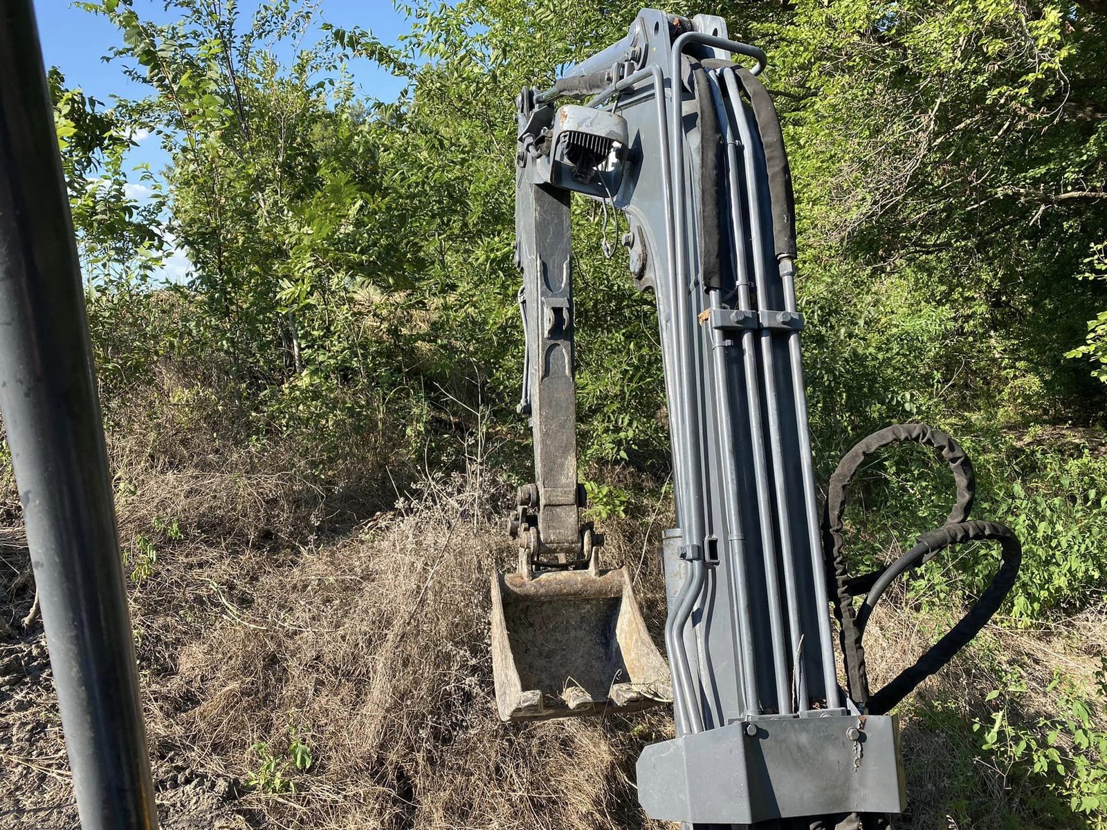 Excavator boom against the sky